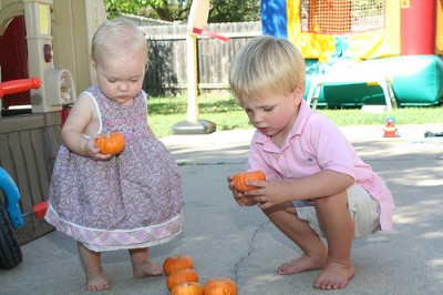 They were working together to stack the pumpkins.