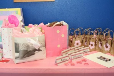 Gifts for Becca, name cards, name buttons, and goody bags.