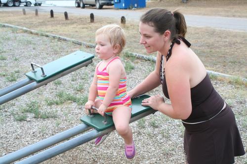 Jillian getting some help on the see-saw.