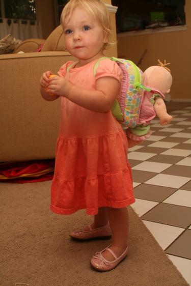 Here she is - our big girl.  Wearing the new backpack and baby and she is also wearing her new sparkly pink shoes - which she got from us too.