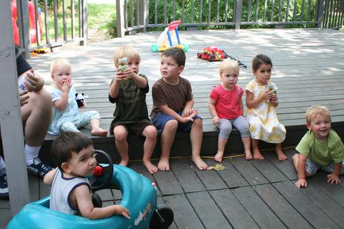 They are all waiting very patiently for their cupcakes.